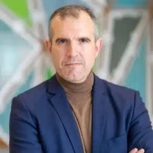 Photo of Dr. Teodor Grantcharov, wearing a dark blue blazer with a brown sweater.
